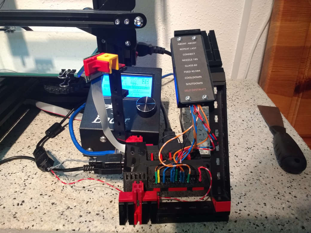Raspberry pi with a button board next to 3D printer